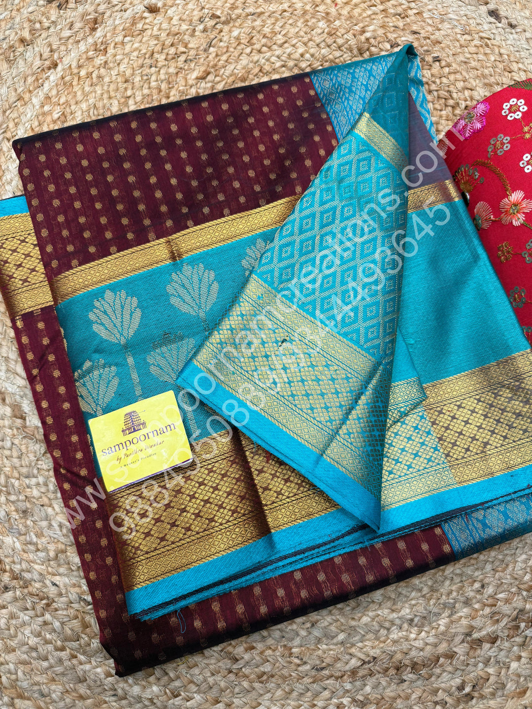 Maroon with Turquoise Blue  , rich Lakshadeepam butta in the body , one side long traditional Borders and Grand Pallu Korvai Silk Cotton Saree