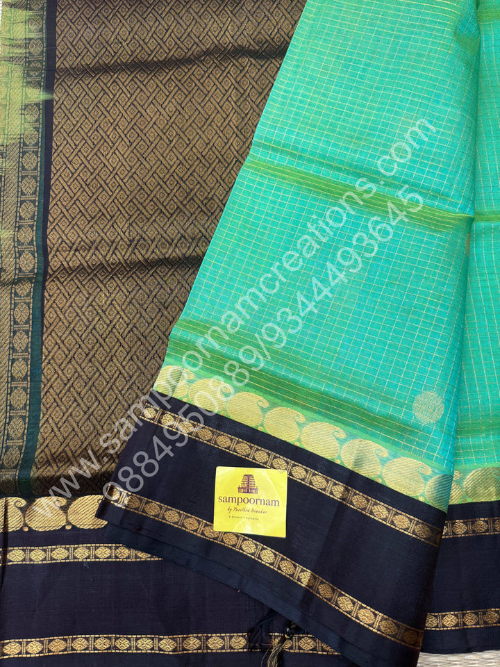 Sea Green Gold with Dark Brown , Zari checks , Mayil and Chakram rich butta in the body , rich borders with traditional Pallu Korvai Silk Cotton Saree