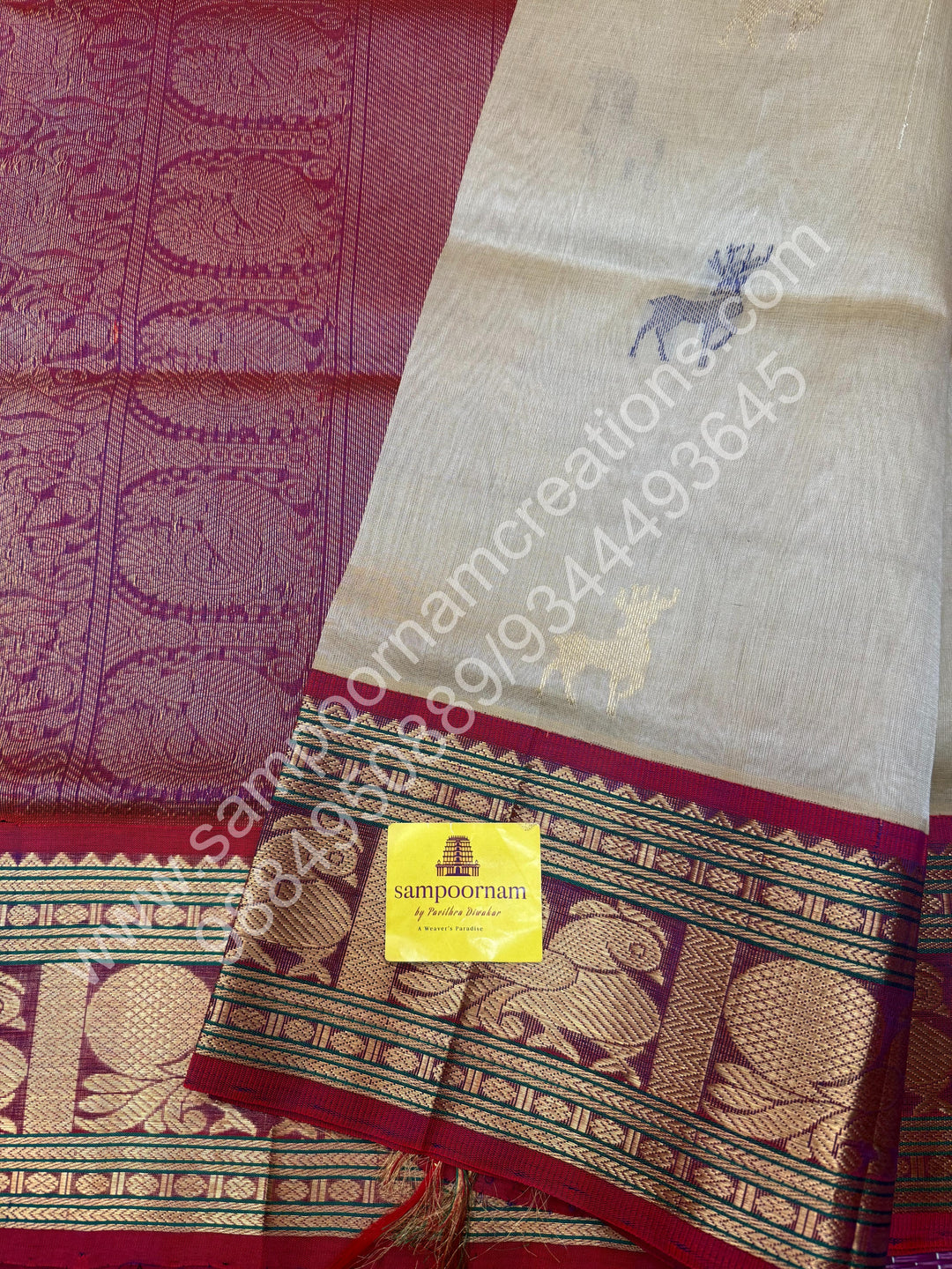 Beige with Magenta  , rich Zari and Thread deer butta in the body , one side long traditional Borders and Grand Pallu Korvai Silk Cotton Saree