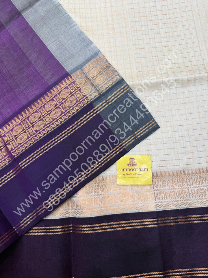 Offwhite with Wine  , Zari checks in the body , rich borders with traditional Pallu Korvai Silk Cotton Saree