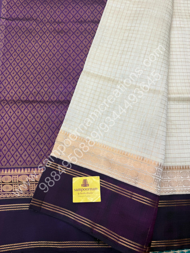 Offwhite with Wine  , Zari checks in the body , rich borders with traditional Pallu Korvai Silk Cotton Saree