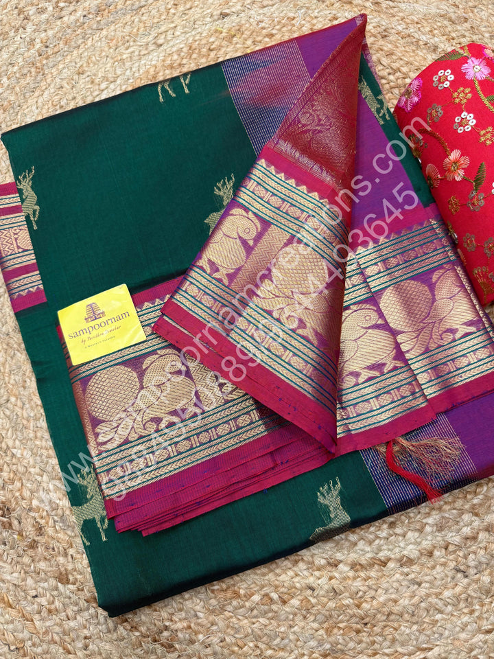 Dark Green with Magenta  , rich Zari  deer butta in the body , one side long traditional Borders and Grand Pallu Korvai Silk Cotton Saree