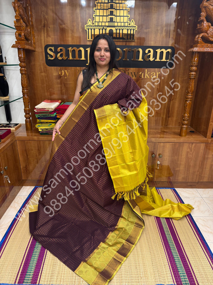 Brown with Lemon Yellow ,  , rich Zari butta in the body , one side big Satin Borders with Floral motif , traditional borders and Grand Pallu Korvai Silk Cotton Saree