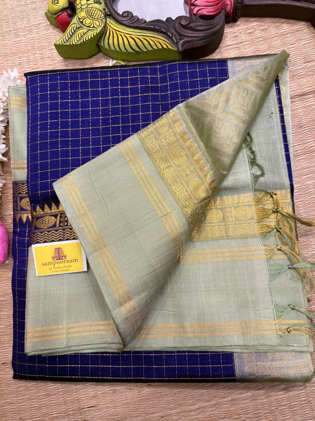 Blue with Pastel Green , rich zari checks in the body , rettapet border and rich Pallu Korvai Silk Cotton Saree