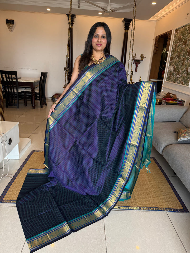 Dark Blue with Light Blue , Lakshadeepam butta in the body , traditional borders and rich Pallu Lakshadeepam Silk Cotton Saree