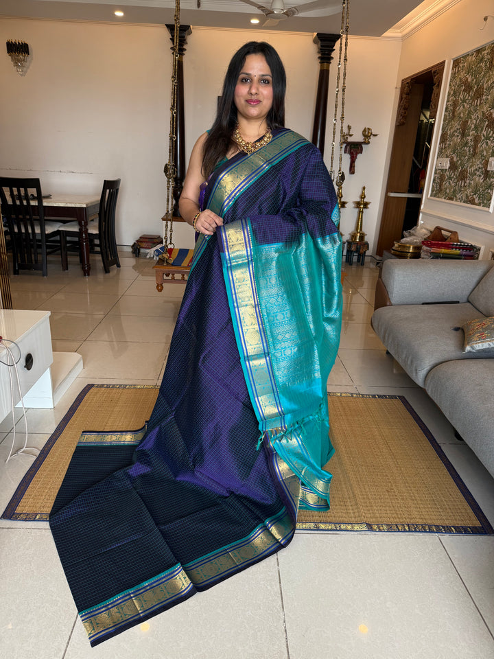 Dark Blue with Light Blue , Lakshadeepam butta in the body , traditional borders and rich Pallu Lakshadeepam Silk Cotton Saree