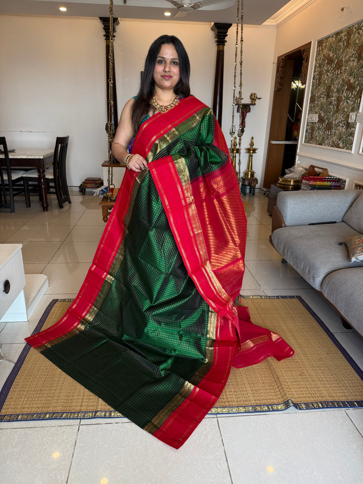Green with Red , rich zari checks in the body , rettapet border and rich Pallu Korvai Silk Cotton Saree