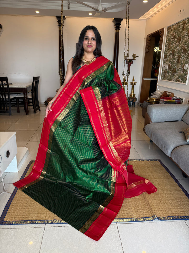 Green with Red , rich zari checks in the body , rettapet border and rich Pallu Korvai Silk Cotton Saree