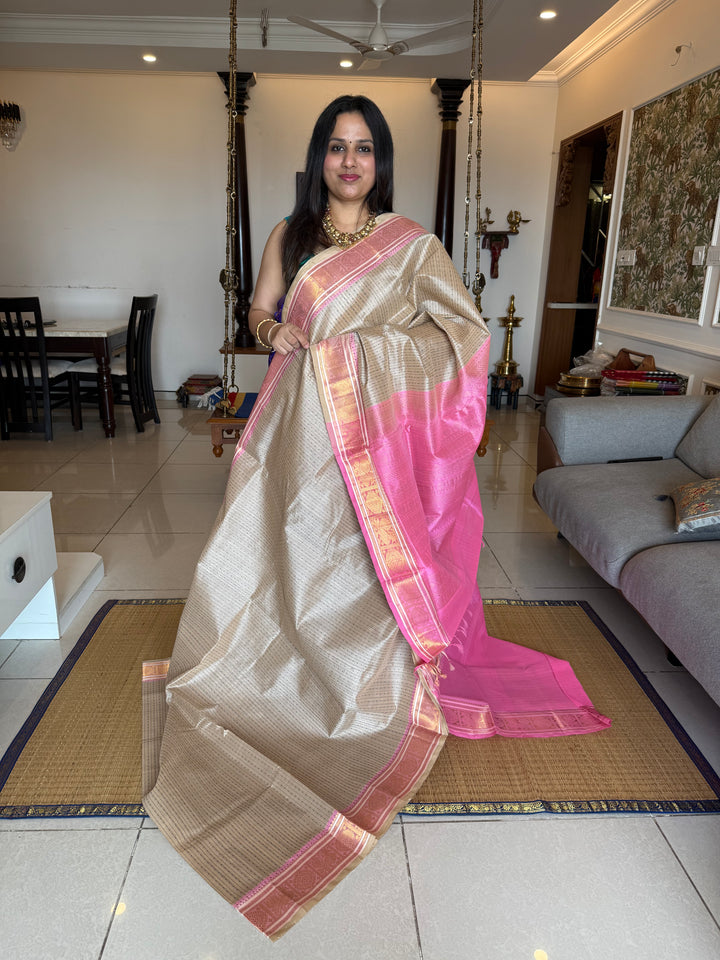 Offwhite with Baby Pink , Lakshadeepam butta in the body , traditional borders and rich Pallu Lakshadeepam Silk Cotton Saree