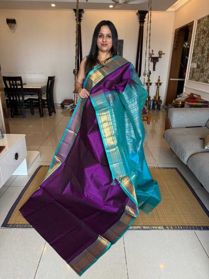 Purple with Turquoise Blue , Lakshadeepam butta in the body , traditional borders and rich Pallu Lakshadeepam Silk Cotton Saree