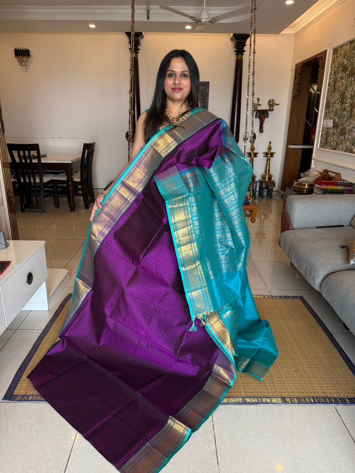 Purple with Turquoise Blue , Lakshadeepam butta in the body , traditional borders and rich Pallu Lakshadeepam Silk Cotton Saree