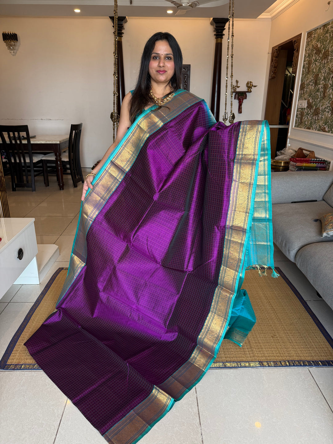 Purple with Turquoise Blue , Lakshadeepam butta in the body , traditional borders and rich Pallu Lakshadeepam Silk Cotton Saree