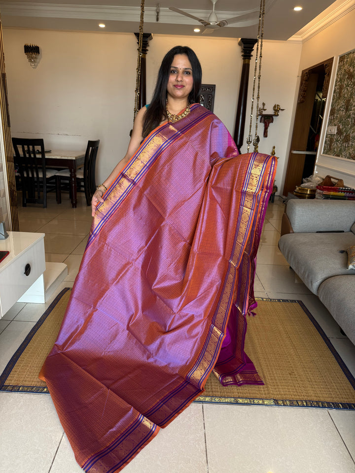 Lavender with Purple , Lakshadeepam butta in the body , traditional borders and rich Pallu Lakshadeepam Silk Cotton Saree