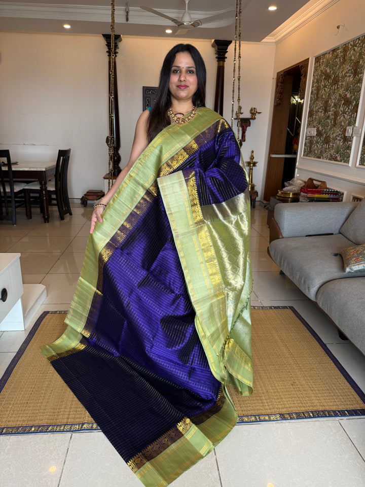 Blue with Pastel Green , rich zari checks in the body , rettapet border and rich Pallu Korvai Silk Cotton Saree