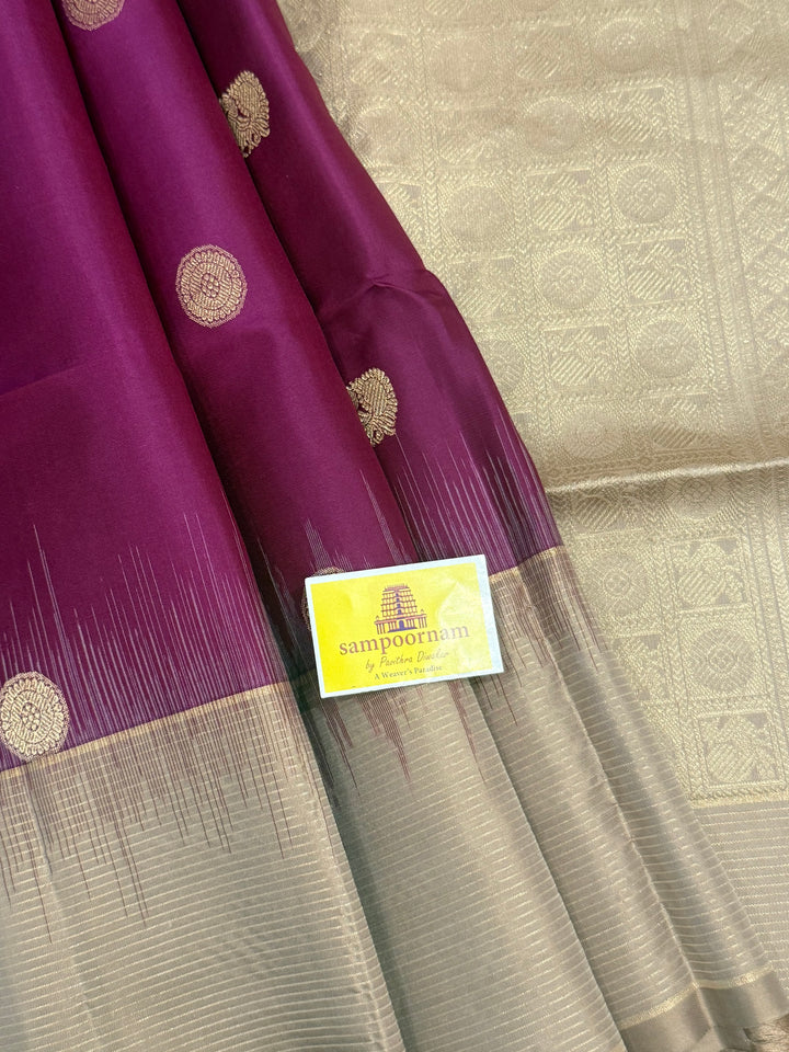 Dark Wine with Beige , rich Zari annam and rudraksh butta in the body and vairaoosi border , pure soft silk saree