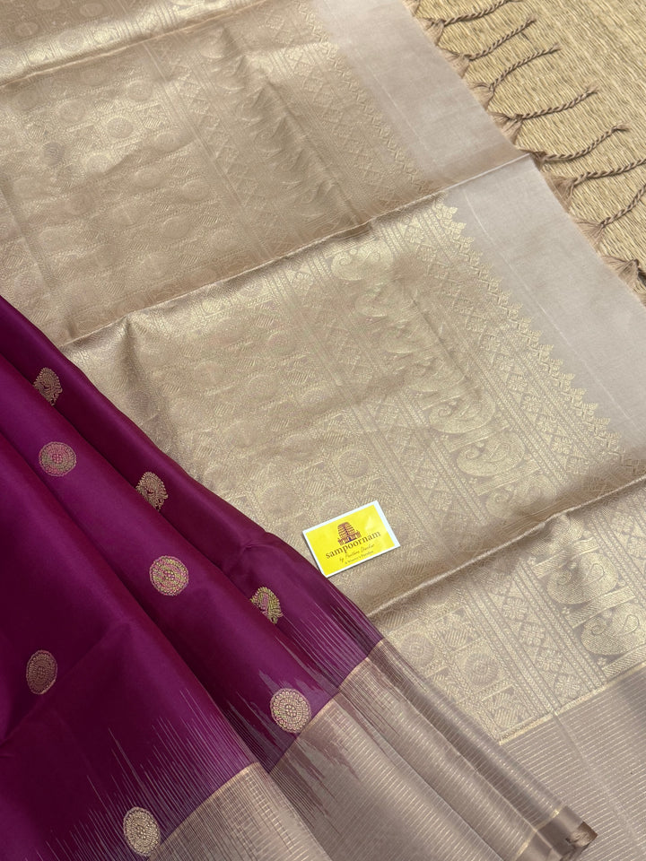 Dark Wine with Beige , rich Zari annam and rudraksh butta in the body and vairaoosi border , pure soft silk saree