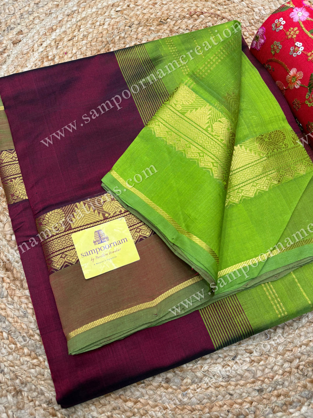 Traditional plain silk cotton saree in rich dark maroon with a light leaf green contrast  a timeless combination.