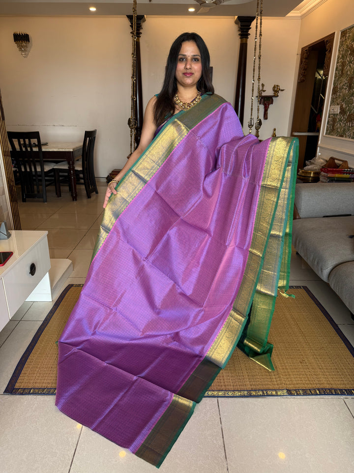 Lavender with Green , Lakshadeepam butta in the body , traditional borders and rich Pallu Lakshadeepam Silk Cotton Saree