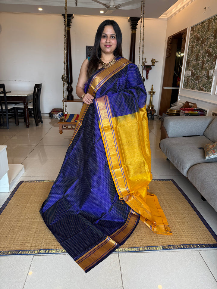 Blue with Yellow , Lakshadeepam butta in the body , traditional borders and rich Pallu Lakshadeepam Silk Cotton Saree
