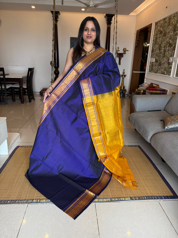 Blue with Yellow , Lakshadeepam butta in the body , traditional borders and rich Pallu Lakshadeepam Silk Cotton Saree
