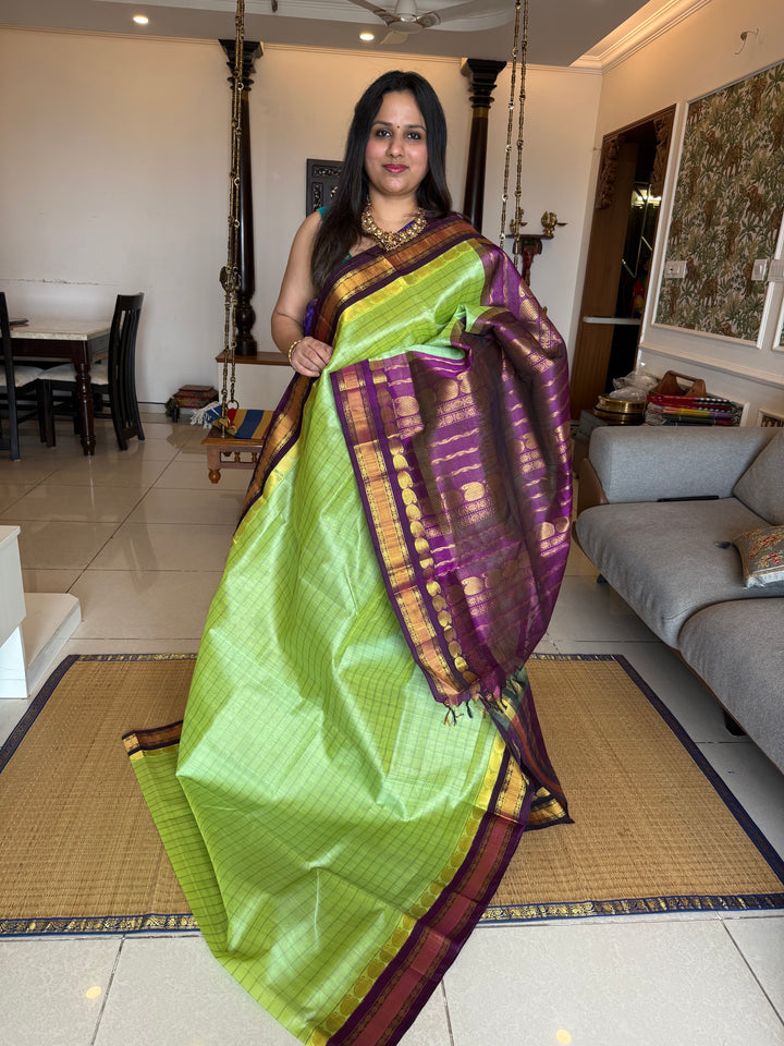 Pastel Green with Purple , kattam in the body , traditional borders and rich Pallu Korvai Silk Cotton Saree