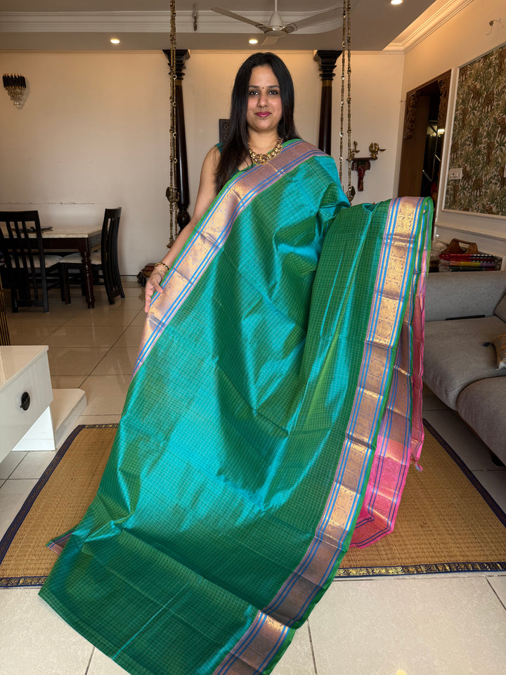 Turquoise Blue with Baby Pink , Lakshadeepam butta in the body , traditional borders and rich Pallu Lakshadeepam Silk Cotton Saree