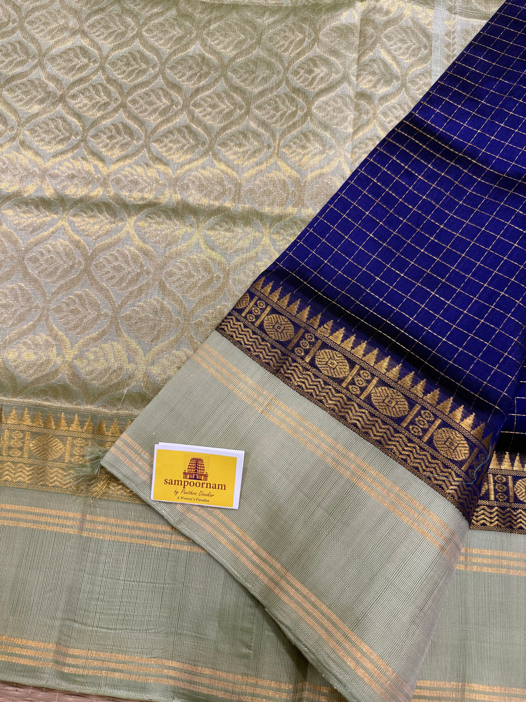 Blue with Pastel Green , rich zari checks in the body , rettapet border and rich Pallu Korvai Silk Cotton Saree