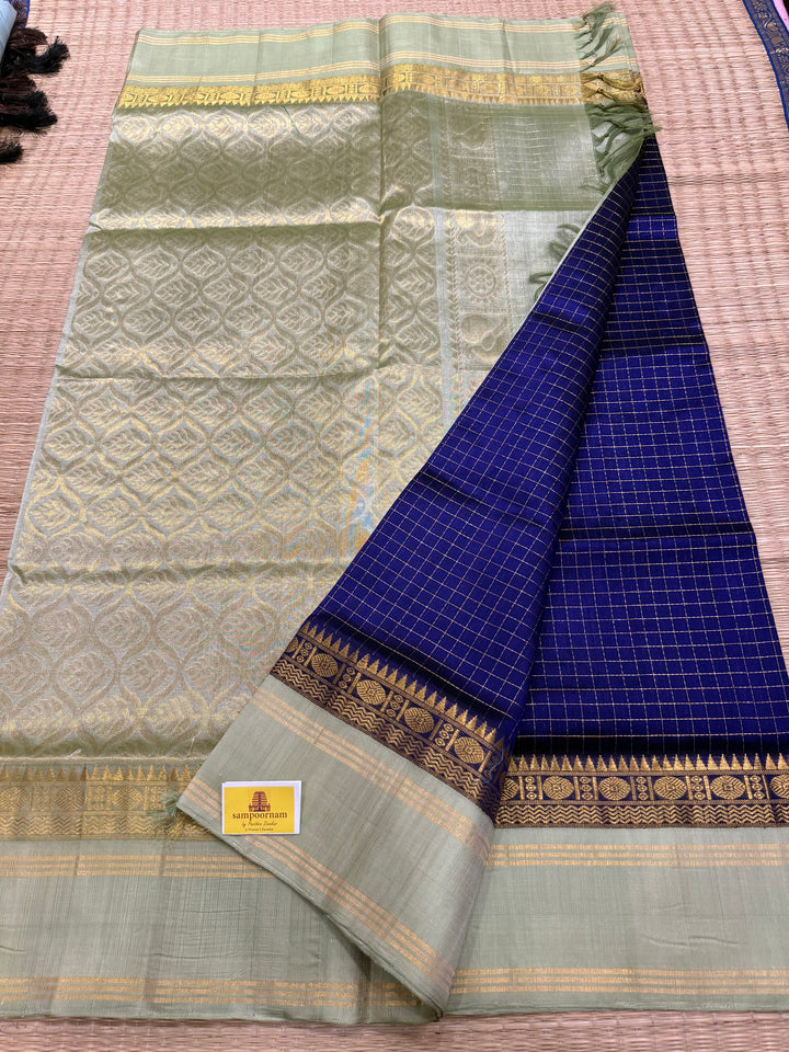 Blue with Pastel Green , rich zari checks in the body , rettapet border and rich Pallu Korvai Silk Cotton Saree