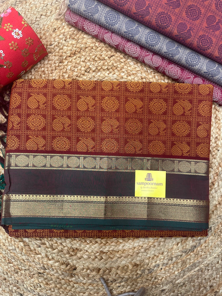 Brick Red with Manthulir Green  , Annam and Chakram thread butta in the body  , rettapet border and Plain Pallu Chettinad Cotton Saree