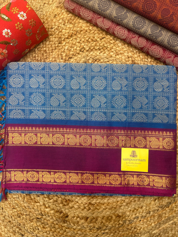 Light Blue with Dark Magenta , Annam and Chakram Butta in the body and plain Pallu Chettinad Cotton Saree