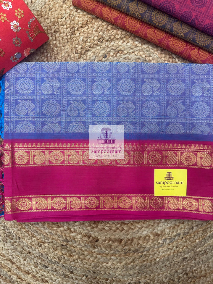 Light Blue with Pink  , Annam and Chakram thread butta in the body  , rettapet border and Plain  Pallu Chettinad Cotton Saree