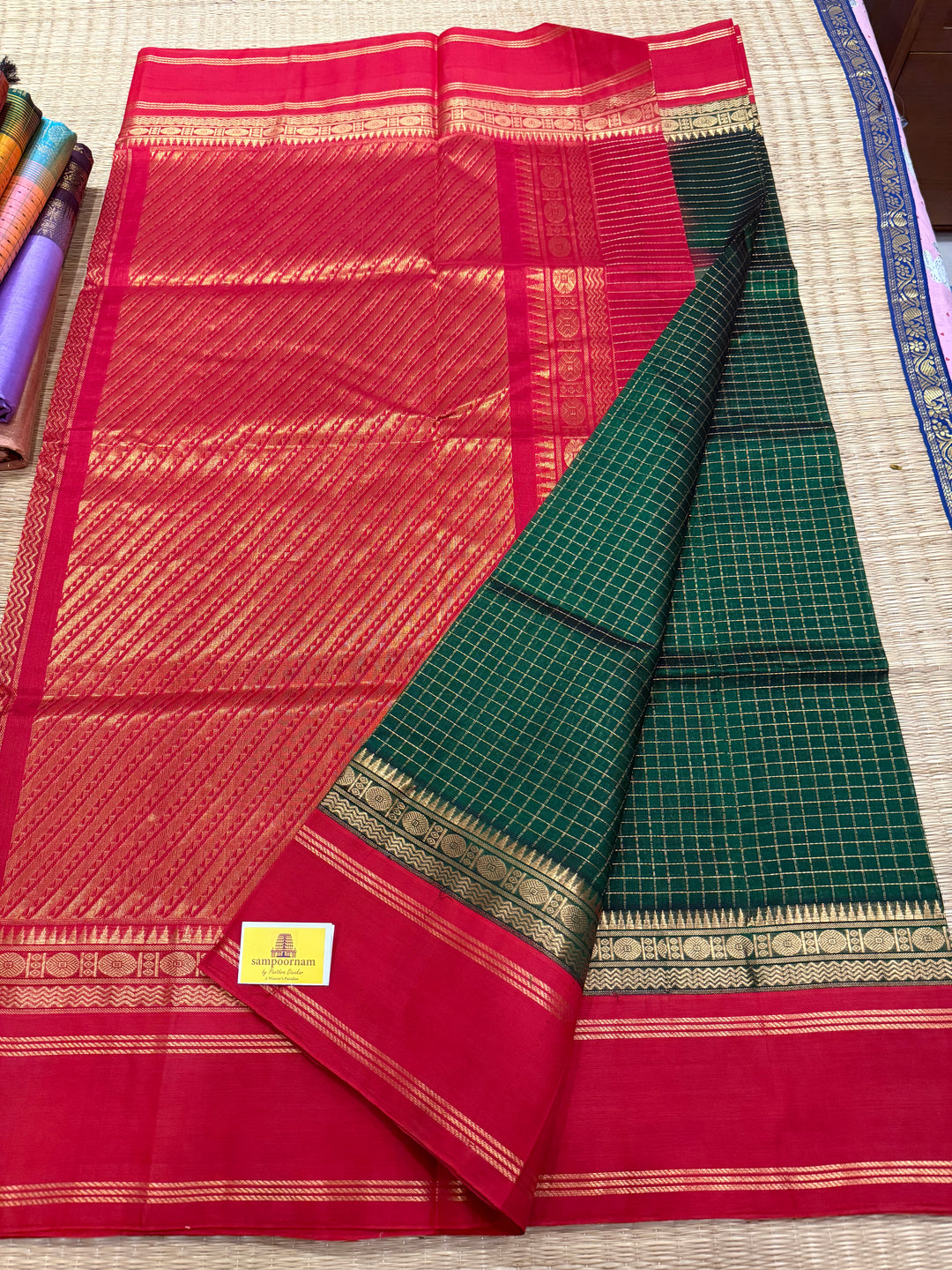 Green with Red , rich zari checks in the body , rettapet border and rich Pallu Korvai Silk Cotton Saree