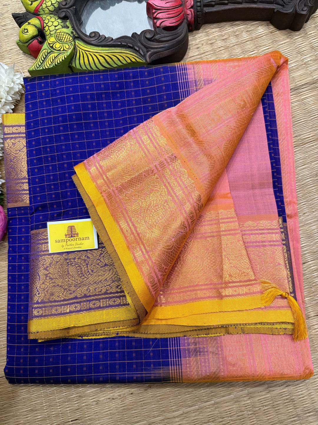 Blue with Baby Pink and Yellow sell edge , Lakshadeepam butta in the body , traditional borders and rich Pallu Lakshadeepam Silk Cotton Saree