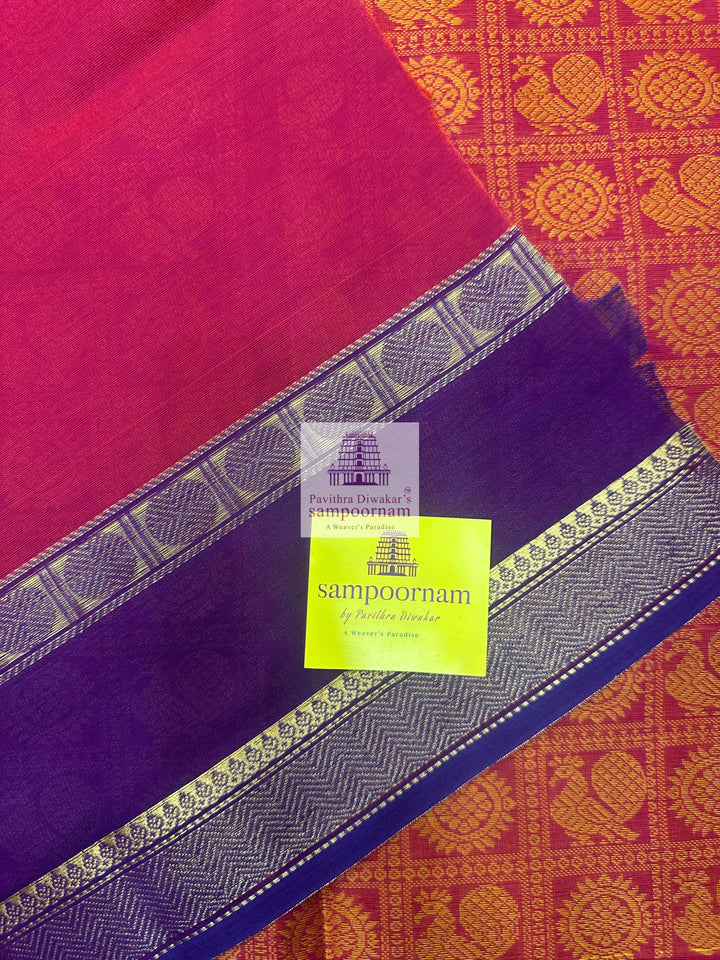 Reddish Orange with Purple  , Annam and Chakram thread butta in the body  , rettapet border and Plain  Pallu Chettinad Cotton Saree