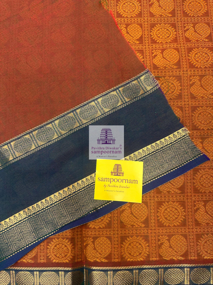 Ochre with Mayilkazhuthu colour , Annam and Chakram thread butta in the body  , rettapet border and Plain  Pallu Chettinad Cotton Sareekazhuthu