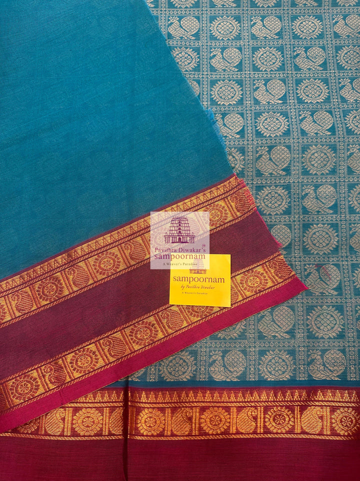 Light Blue with Magenta  , Annam and Chakram thread butta in the body  , rettapet border and Plain  Pallu Chettinad Cotton Saree