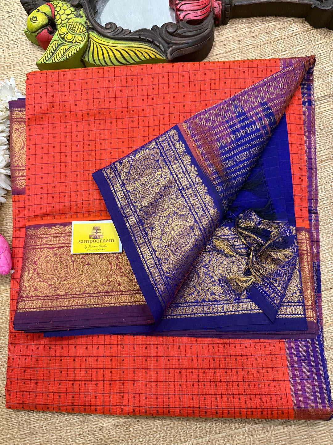 Orange with Blue , Lakshadeepam butta in the body , traditional borders and rich Pallu Lakshadeepam Silk Cotton Saree