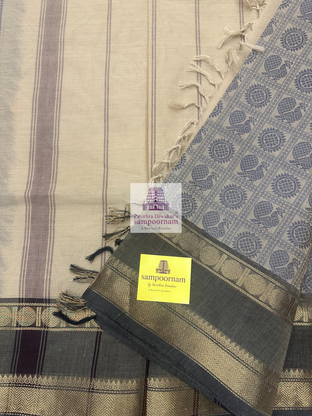 Cream with Grey  , Annam and Chakram thread butta in the body  , rettapet border and plain Pallu Chettinad Cotton Saree