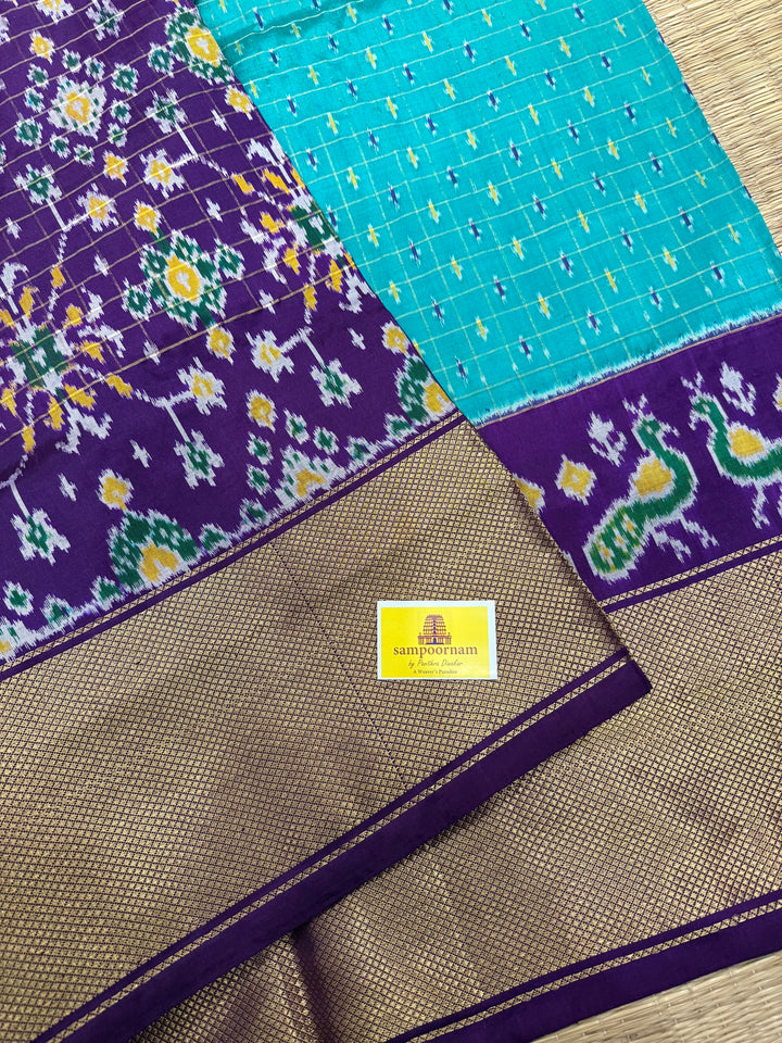 Turquoise Blue with Purple , checks in the body , design the blouse , traditional Kanchi borders and rich Pallu Pochampally Ikkat Silk Saree
