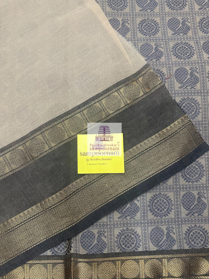 Cream with Grey  , Annam and Chakram thread butta in the body  , rettapet border and plain Pallu Chettinad Cotton Saree