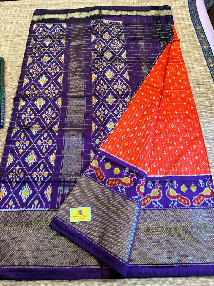 Orange with Purple ,checks in the body , traditional borders , work in blouse and rich Pallu Pochampally Ikkat Silk Saree