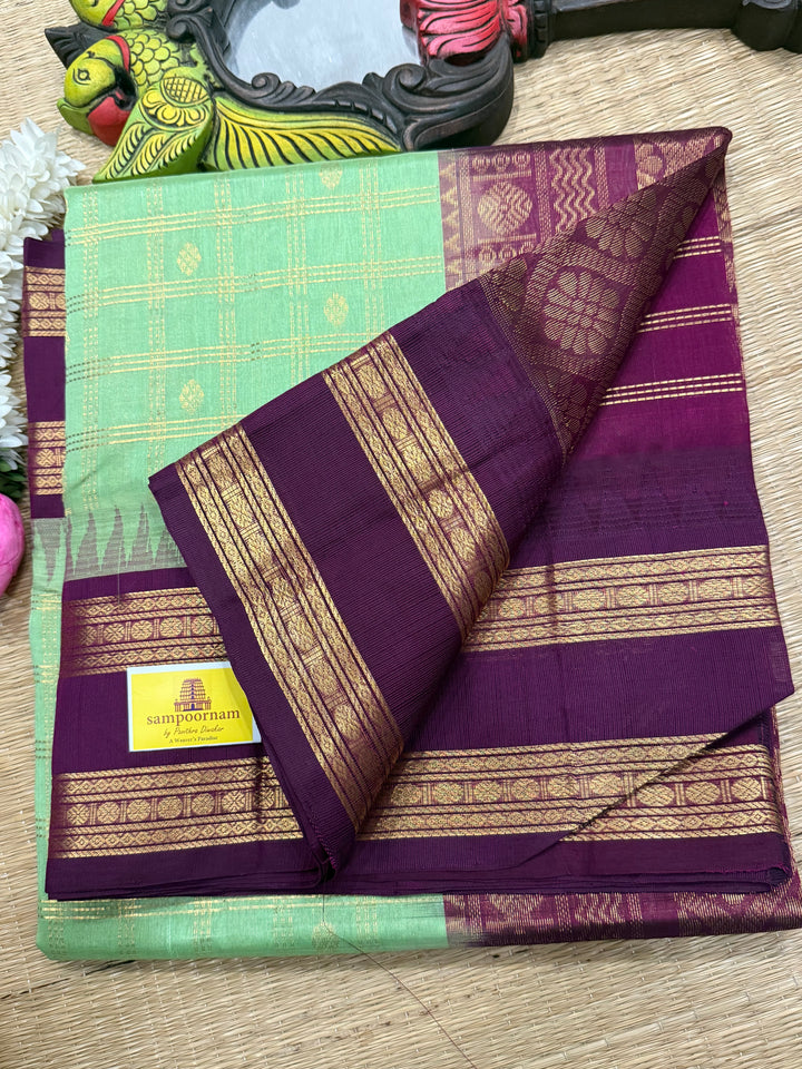 Mint Green with Dark Maroon , rich zari butta in the body , traditional rettapet border and rich Pallu Korvai Silk Cotton Saree