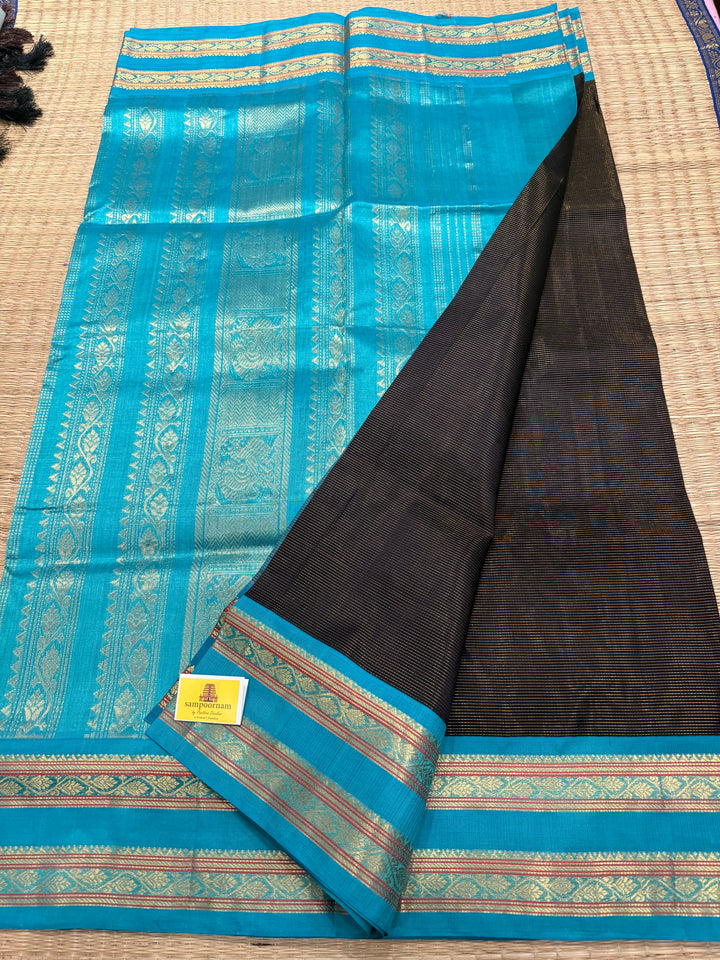 Black with Turquoise Blue ,Zari Podi Kattam in the body ,rettapet border and rich Pallu Korvai Silk Cotton Saree