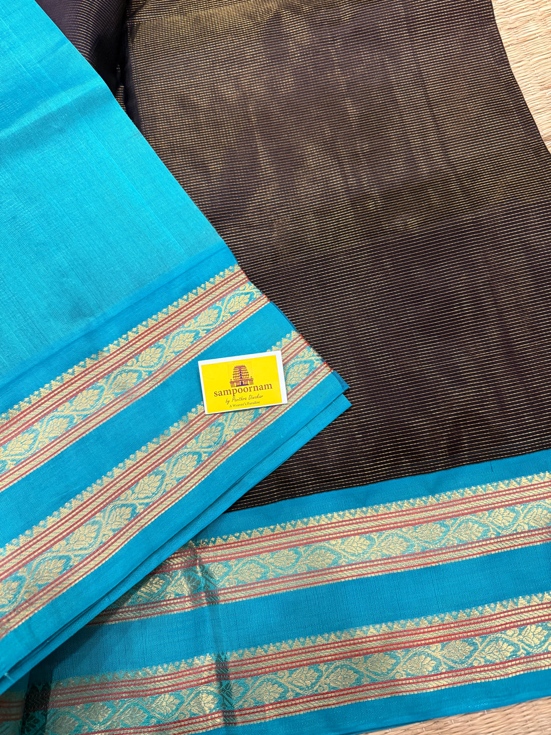 Black with Turquoise Blue ,Zari Podi Kattam in the body ,rettapet border and rich Pallu Korvai Silk Cotton Saree
