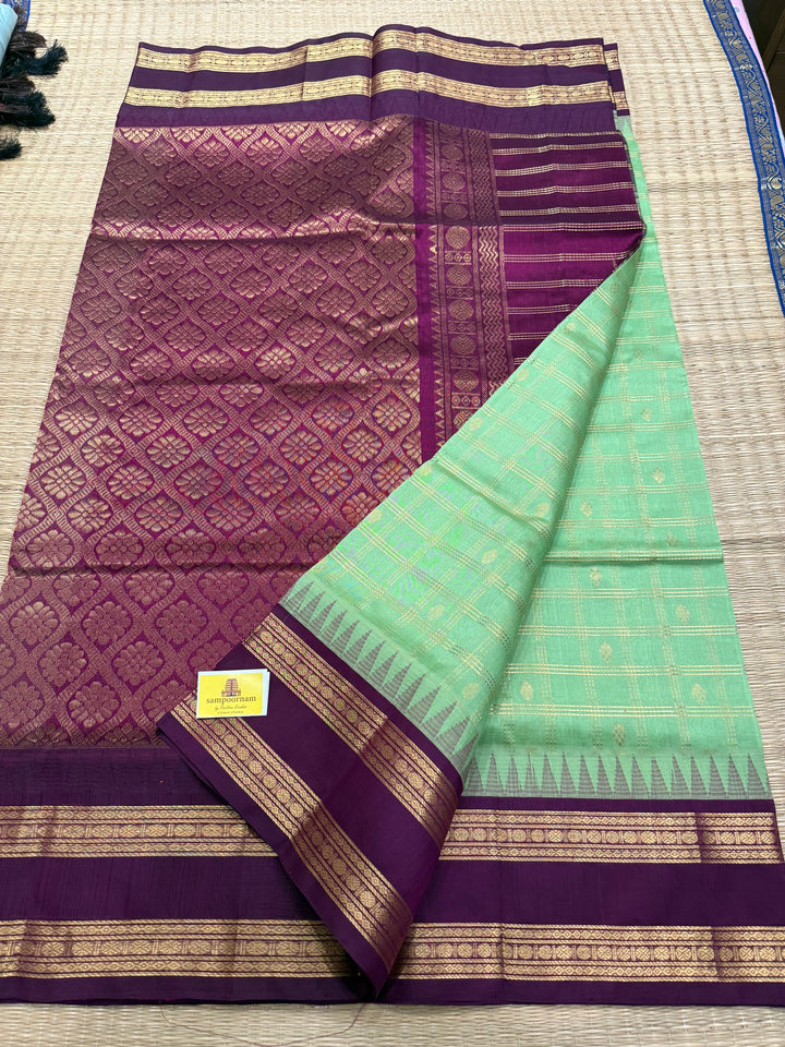 Mint Green with Dark Maroon , rich zari butta in the body , traditional rettapet border and rich Pallu Korvai Silk Cotton Saree