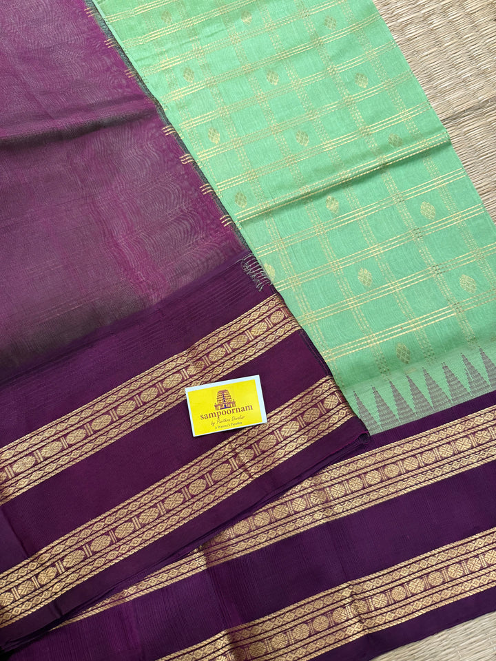 Mint Green with Dark Maroon , rich zari butta in the body , traditional rettapet border and rich Pallu Korvai Silk Cotton Saree