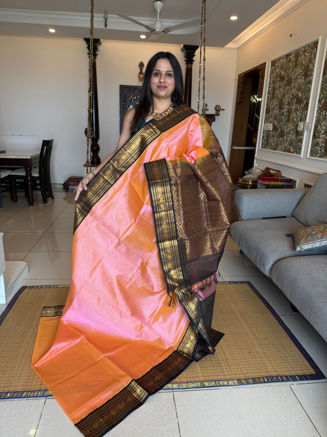 Peachish Pink with Black Vairaoosi Zari Lines in the body traditional borders and rich Pallu Korvai Silk Cotton Saree