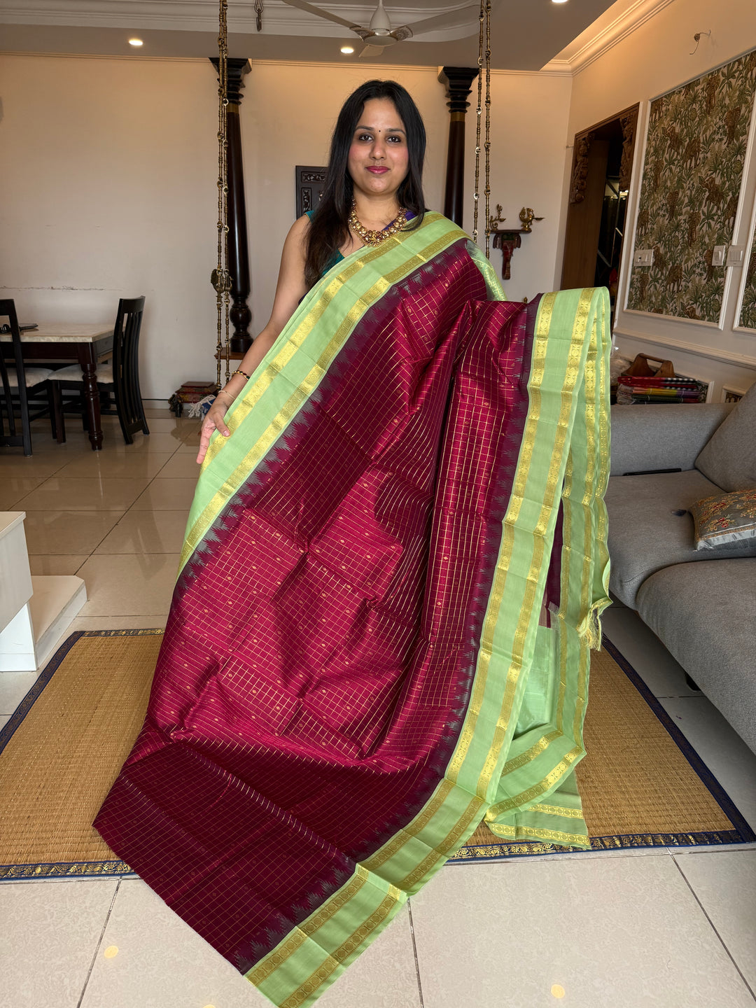 Dark Maroon with Mint Green , rich zari butta in the body , traditional rettapet border and rich Pallu Korvai Silk Cotton Saree