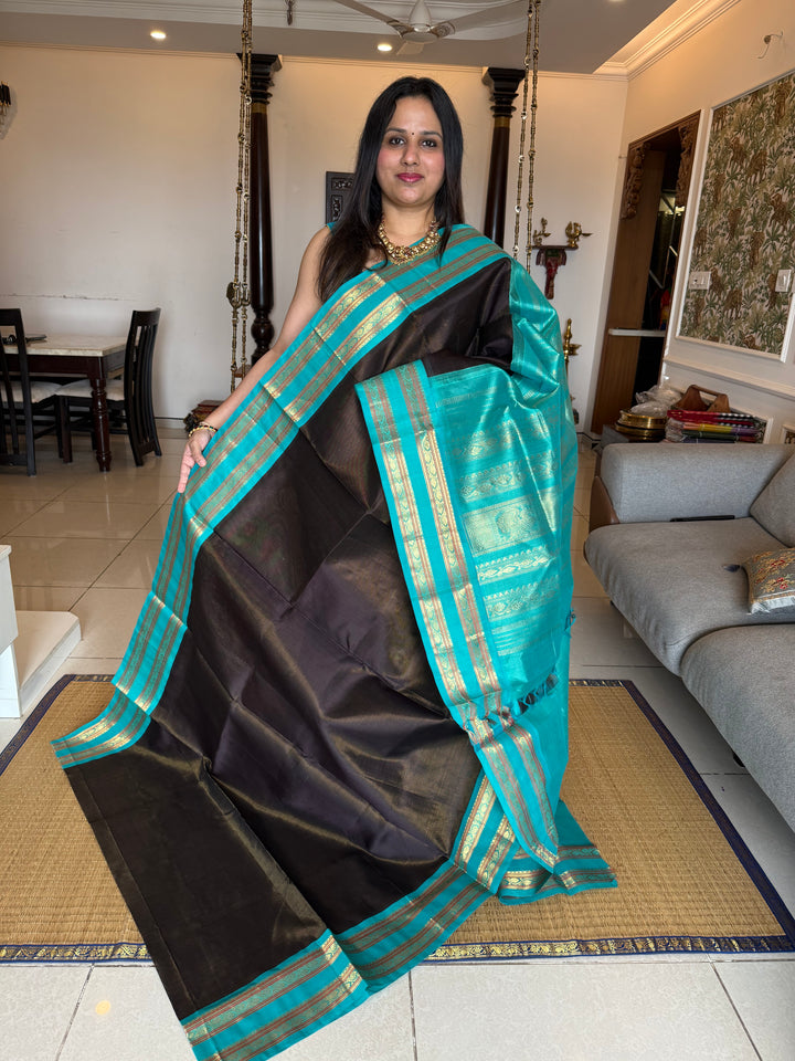 Black with Turquoise Blue ,Zari Podi Kattam in the body ,rettapet border and rich Pallu Korvai Silk Cotton Saree