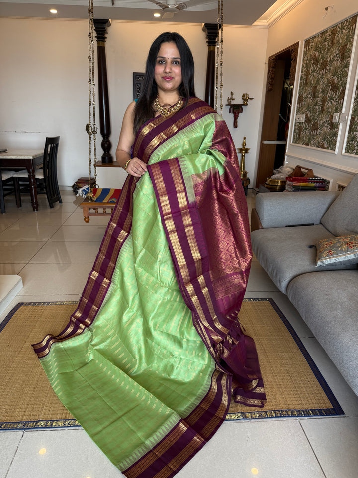 Mint Green with Dark Maroon , rich zari butta in the body , traditional rettapet border and rich Pallu Korvai Silk Cotton Saree